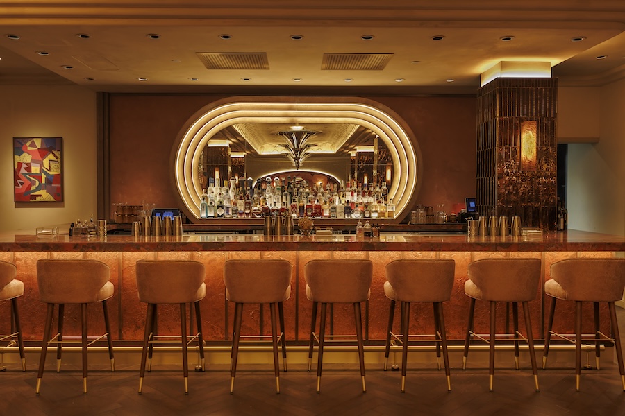 my girl restaurant boston red yellow orange warm sunset palette wall mural curtains arched doorway swivel armchairs palm pattern bar