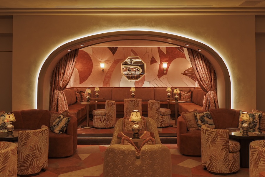 my girl restaurant boston red yellow orange warm sunset palette wall mural curtains arched doorway swivel armchairs palm pattern