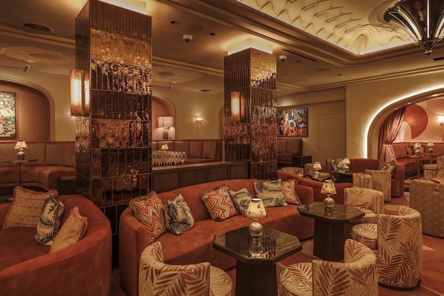 my girl restaurant boston red yellow orange warm sunset palette wall mural curtains arched doorway swivel armchairs palm pattern