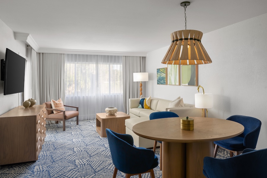 Saddlebrook Resort tampa florida redesign guestrooms navy blue chairs rattan light pendant blue white carpet