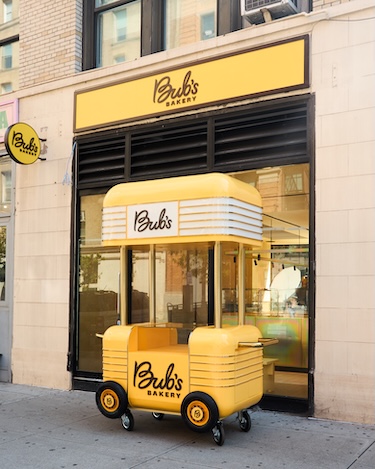bub's bakery yellow sunshine bright allergen free baked goods mobile cart exterior
