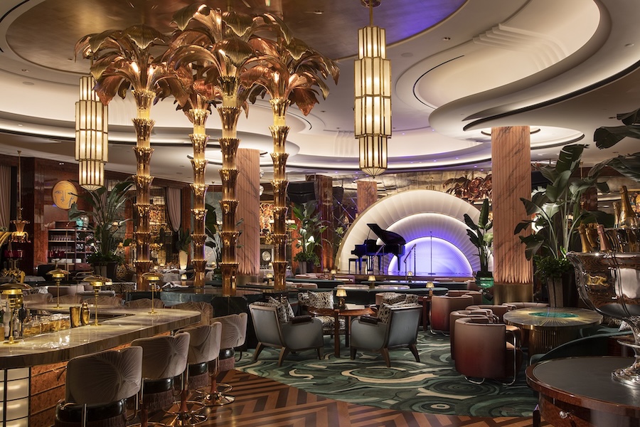 wynn al marjan island resort delilah dining room gold leaf columns stage grand piano