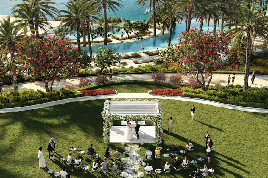 wynn al marjan island resort event lawn celebrations wedding pool ocean view grass aerial view